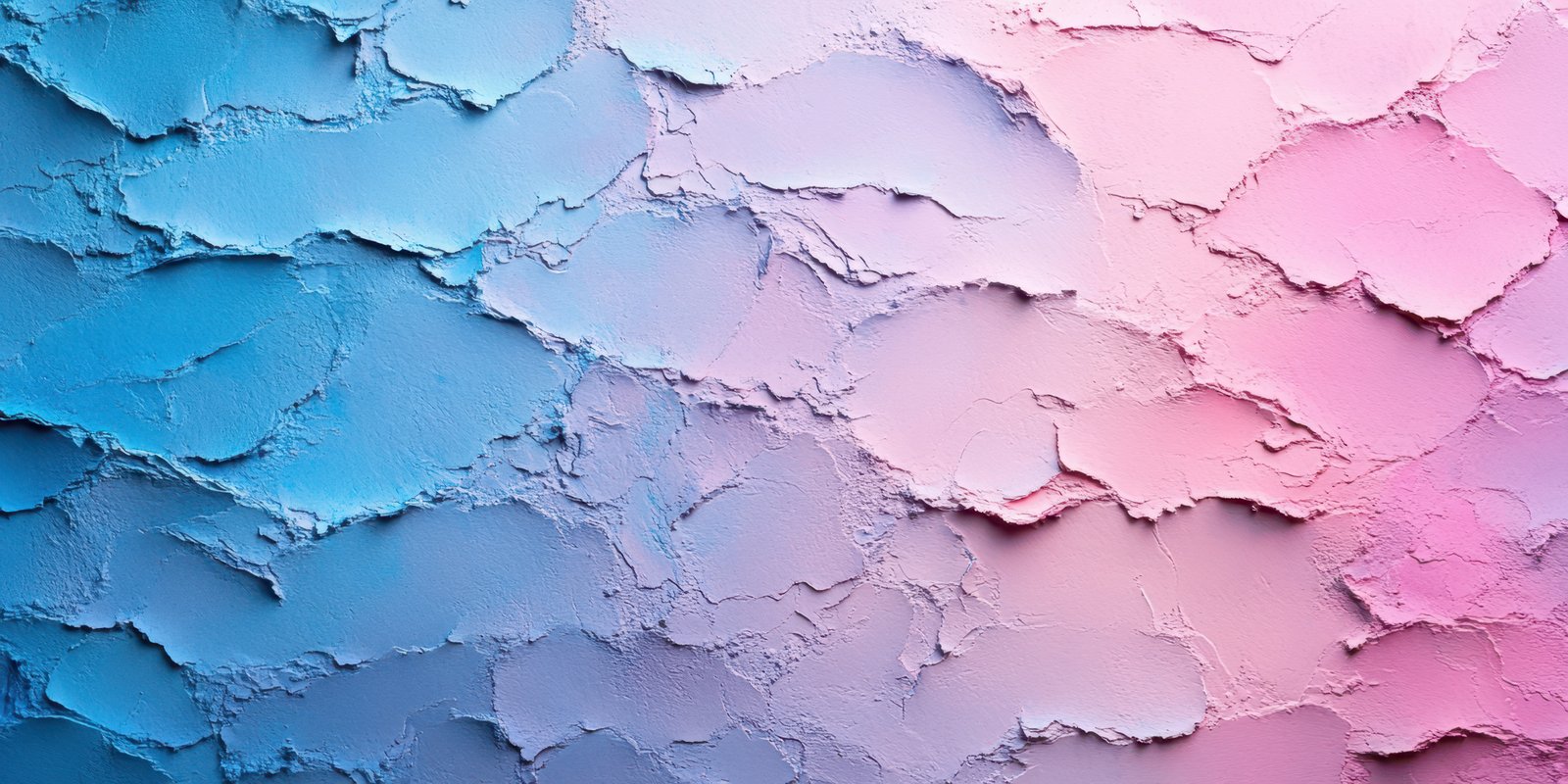 Colorful textured wall in soft pastel shades of blue and pink creates a serene and artistic backdrop for creative projects